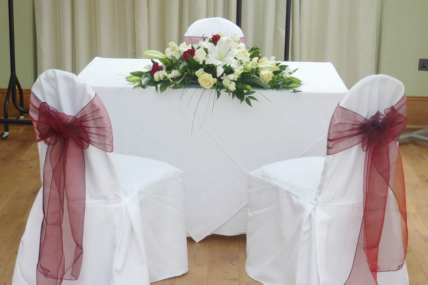 Wedding Chair Covers Red sashes The Bride groom table